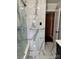 Luxurious bathroom features elegant marble tile, glass shower, and modern fixtures at 1148 Marietta St, Charlotte, NC 28214