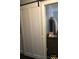 Bedroom entry with a modern sliding barn door and stylish decor at 1148 Marietta St, Charlotte, NC 28214