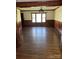 Spacious dining room featuring hardwood floors and a chandelier style light fixture at 1148 Marietta St, Charlotte, NC 28214