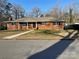 Charming brick home with a well-maintained lawn and classic design at 1148 Marietta St, Charlotte, NC 28214