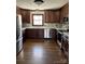 Spacious kitchen with stainless steel appliances, wood cabinets, and marble backsplash at 1148 Marietta St, Charlotte, NC 28214