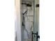 Luxurious shower with marble-style tile, rainfall shower head, and glass door at 1148 Marietta St, Charlotte, NC 28214