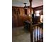Sitting room with wood paneling, a fan, and an adjacent stairwell at 1148 Marietta St, Charlotte, NC 28214