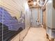 Unfinished basement area featuring painted mural, concrete block wall, exposed beams, and ductwork at 1203 Maple Shade Ln, Charlotte, NC 28270