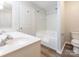 Bathroom featuring dual sinks, a toilet, and a bath tub at 1203 Maple Shade Ln, Charlotte, NC 28270