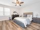 Bedroom featuring natural light, a ceiling fan, and wood-look flooring at 1203 Maple Shade Ln, Charlotte, NC 28270