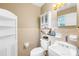 Cozy bathroom featuring neutral walls and tile, a sink and storage cabinets at 1204 Meadowood Dr, Shelby, NC 28150