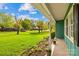 View of the front yard and porch with decorative flowerbeds and a blue exterior at 1204 Meadowood Dr, Shelby, NC 28150