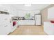 Bright kitchen with white cabinets, white appliances, and tile flooring at 1204 Meadowood Dr, Shelby, NC 28150
