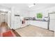 Spacious kitchen with white cabinets, tile flooring, and stainless steel appliances at 1204 Meadowood Dr, Shelby, NC 28150
