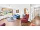 This bright living room features a blue sofa and an ornate framed mirror above at 1204 Meadowood Dr, Shelby, NC 28150