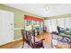Home office featuring a ceiling fan, hardwood floors, and built-in shelving at 1204 Meadowood Dr, Shelby, NC 28150