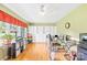 Bright home office with ample storage, a ceiling fan, and gleaming hardwood floors at 1204 Meadowood Dr, Shelby, NC 28150