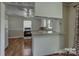 Open kitchen featuring a breakfast bar, tile countertops, and modern appliances at 1308 Lineberger Ave, Gastonia, NC 28052