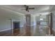 Bright open living area featuring hardwood floors and a fireplace with white trim at 1308 Lineberger Ave, Gastonia, NC 28052