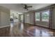 Bright open living area featuring hardwood floors and big windows that bring in natural light at 1308 Lineberger Ave, Gastonia, NC 28052