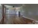 Bright open living area featuring hardwood floors and natural light from the windows at 1308 Lineberger Ave, Gastonia, NC 28052