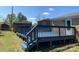 Spacious backyard with a lovely blue wooden deck, offering an ideal space for outdoor entertainment at 131 Mays Ct, Rock Hill, SC 29730