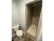 Updated bathroom with a modern tiled shower, a sleek toilet, and stylish flooring at 131 Mays Ct, Rock Hill, SC 29730