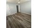 Bright bedroom with light blue walls, wood-look flooring, and a modern ceiling fan at 131 Mays Ct, Rock Hill, SC 29730