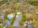 Aerial view of community amenities including the pool, recreation area, and playground at 132 Larboard Trl, Mount Gilead, NC 27306