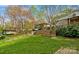 Multi-level backyard leading to an outdoor living space and well-maintained home at 132 Larboard Trl, Mount Gilead, NC 27306