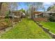 Lush backyard features multiple levels with access to an outdoor living space and home at 132 Larboard Trl, Mount Gilead, NC 27306