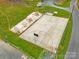 The community has a fenced in basketball court and playground area at 132 Larboard Trl, Mount Gilead, NC 27306