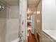 Hallway view into the bathroom with a bathtub, toilet, sink and closet at 132 Larboard Trl, Mount Gilead, NC 27306
