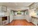 Inviting dining area with hardwood floors, a decorative light fixture and ample natural light at 132 Larboard Trl, Mount Gilead, NC 27306