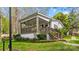 Home with a covered porch, stairway, and beautifully landscaped yard at 132 Larboard Trl, Mount Gilead, NC 27306