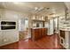 Spacious kitchen with hardwood floors, a refrigerator, ample cabinet space and natural light at 132 Larboard Trl, Mount Gilead, NC 27306