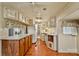 Open kitchen with hardwood floors, ample counter space and plenty of storage cabinets at 132 Larboard Trl, Mount Gilead, NC 27306