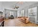 Bright living room with neutral walls, a comfortable sofa, and plenty of natural light at 132 Larboard Trl, Mount Gilead, NC 27306