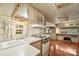The living room features hardwood floors, natural light, ceiling fan and cabinets for storage at 132 Larboard Trl, Mount Gilead, NC 27306