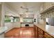 Open living space features wood floors, neutral walls, a ceiling fan and built in storage at 132 Larboard Trl, Mount Gilead, NC 27306