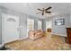 Comfortable living room with neutral walls, a cozy sofa, and a view into the next room at 132 Larboard Trl, Mount Gilead, NC 27306