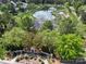 Aerial view of the community pond with lush landscaping at 13610 Aldenbrook Dr, Huntersville, NC 28078