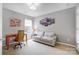 Cozy room offering a comfortable sofa, desk area, and neutral decor at 13610 Aldenbrook Dr, Huntersville, NC 28078