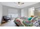 Bedroom featuring a chair near the window and vibrant bedding at 13610 Aldenbrook Dr, Huntersville, NC 28078