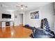 Home gym with hardwood floors, ample lighting, and exercise equipment at 13610 Aldenbrook Dr, Huntersville, NC 28078