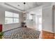 Dining area with hardwood floors, a large window, and modern lighting fixture at 13610 Aldenbrook Dr, Huntersville, NC 28078