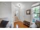 Bright entryway with hardwood floors, stairs, and natural light at 13610 Aldenbrook Dr, Huntersville, NC 28078