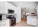 View of the kitchen with stainless steel appliances, granite countertops, and stylish backsplash at 13610 Aldenbrook Dr, Huntersville, NC 28078