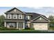 Charming two-story home featuring a manicured lawn and a two-car garage at 1465 Mocksville Hwy # 20, Statesville, NC 28625