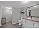 Well-lit bathroom with a shower-tub combo, a toilet, and a stylish mirror above the vanity at 151 Brown Farms Dr, Cleveland, NC 27013