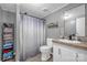 Bathroom with shower/tub combo, modern vanity, and stylish gray color scheme at 151 Brown Farms Dr, Cleveland, NC 27013