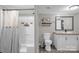 Well-lit bathroom with a shower-tub combo, a toilet, and a modern vanity with a stylish mirror at 151 Brown Farms Dr, Cleveland, NC 27013