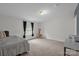 Spacious bedroom features neutral tones, large window, and a cozy lamp-lit ambiance at 151 Brown Farms Dr, Cleveland, NC 27013