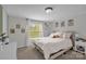 Bright bedroom featuring neutral walls, a large window, and a comfortable bed at 151 Brown Farms Dr, Cleveland, NC 27013